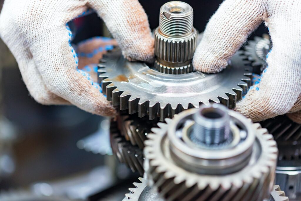 Technician opening an automatic transmission during a transmission repair at JP Euro in Garland, TX
